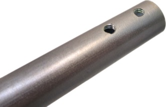 A drilled and tapped tube